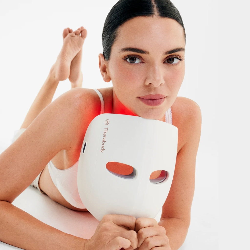 Kendall Jenner holding a LED Mask from Therabody